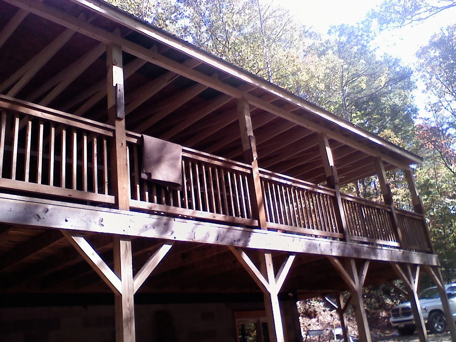 Timber framing under a new elevated porch and deck — Roof Leak Repair in Plattsburgh by Roofing Brothers